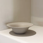 Side view of rustic stoneware bowl