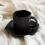 tea cup and saucer matte black minimalist morning ritual
