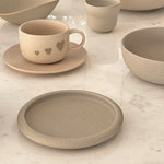 Drum-edge plate with cup and bowl collection