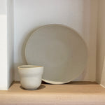 Cloud cup with round plate on wooden shelf