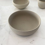 Ribbed breakfast bowl with cup on marble