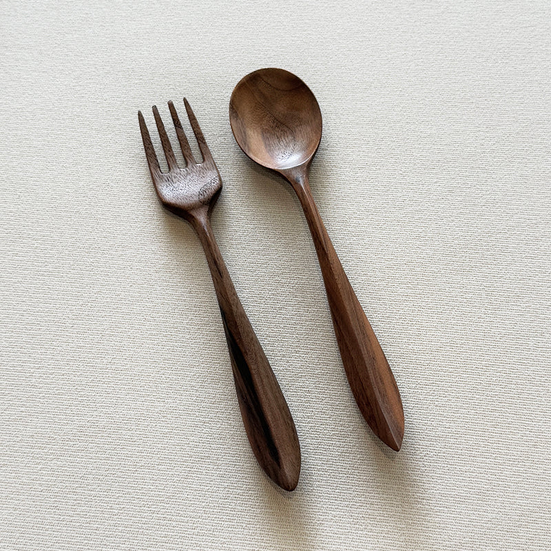 Walnut fork and spoon set on linen background