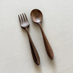 Walnut fork and spoon set on linen background