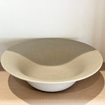 Low angle view of wide rim stoneware bowl