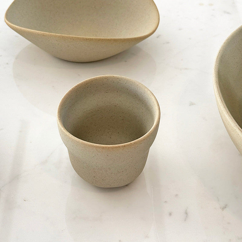 Cloud cup on marble surface with bowls