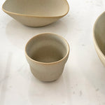 Cloud cup on marble surface with bowls