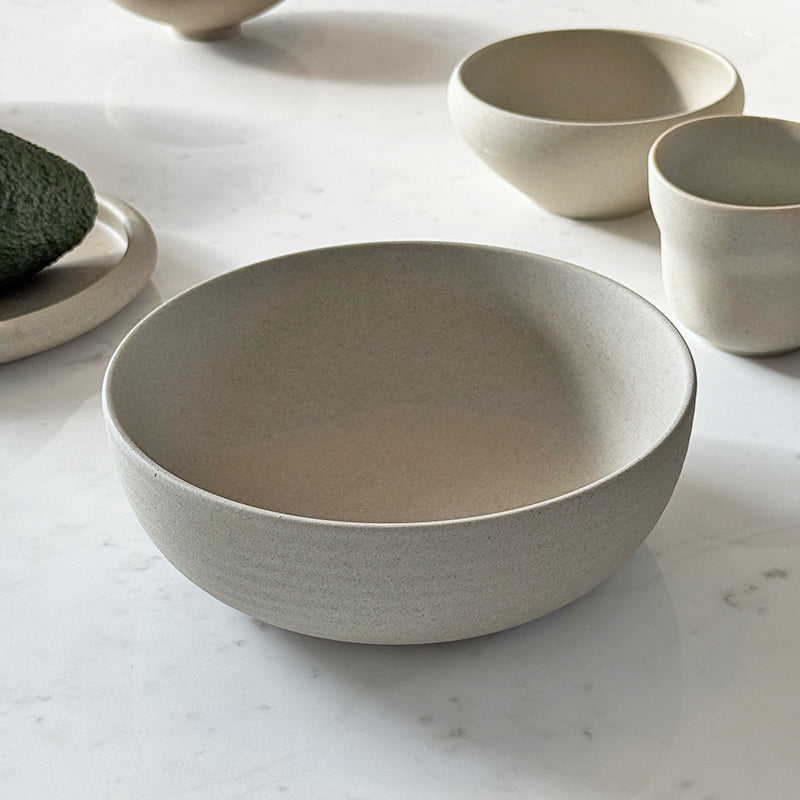Ribbed breakfast bowl with avocado on marble