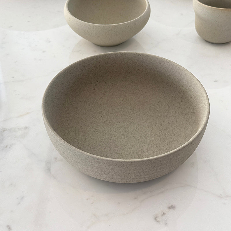 Ribbed breakfast bowl with cup on marble