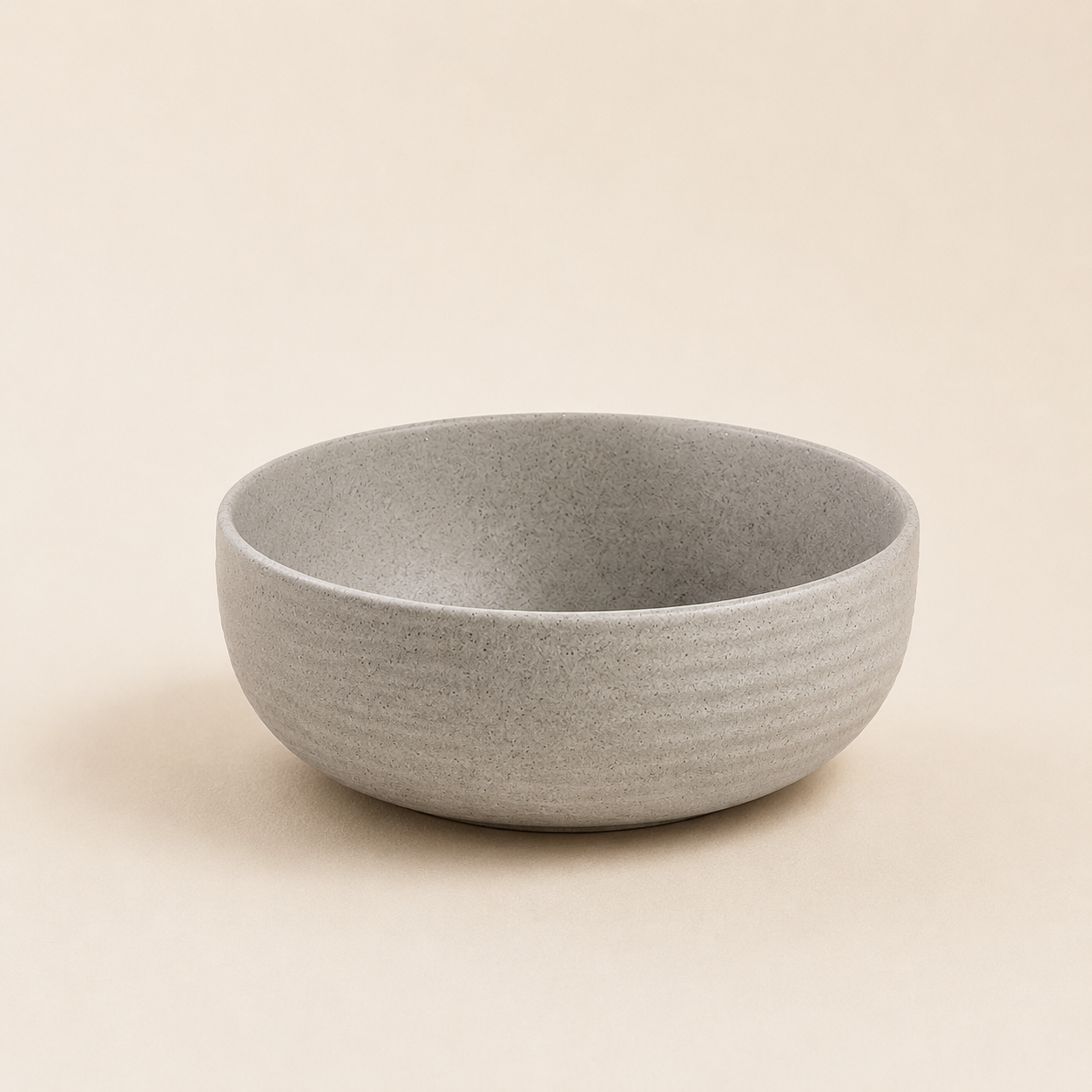 Speckled gray stoneware bowl with horizontal ribbing