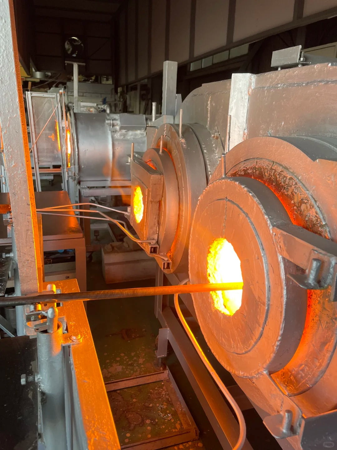 Glassmaking furnaces with heated openings