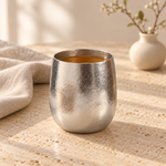 Pebble titanium tea cup on a cream stone table with beige linen