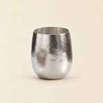 Sundayware Pebble 280ml titanium cup with ice-flower texture on a warm cream background