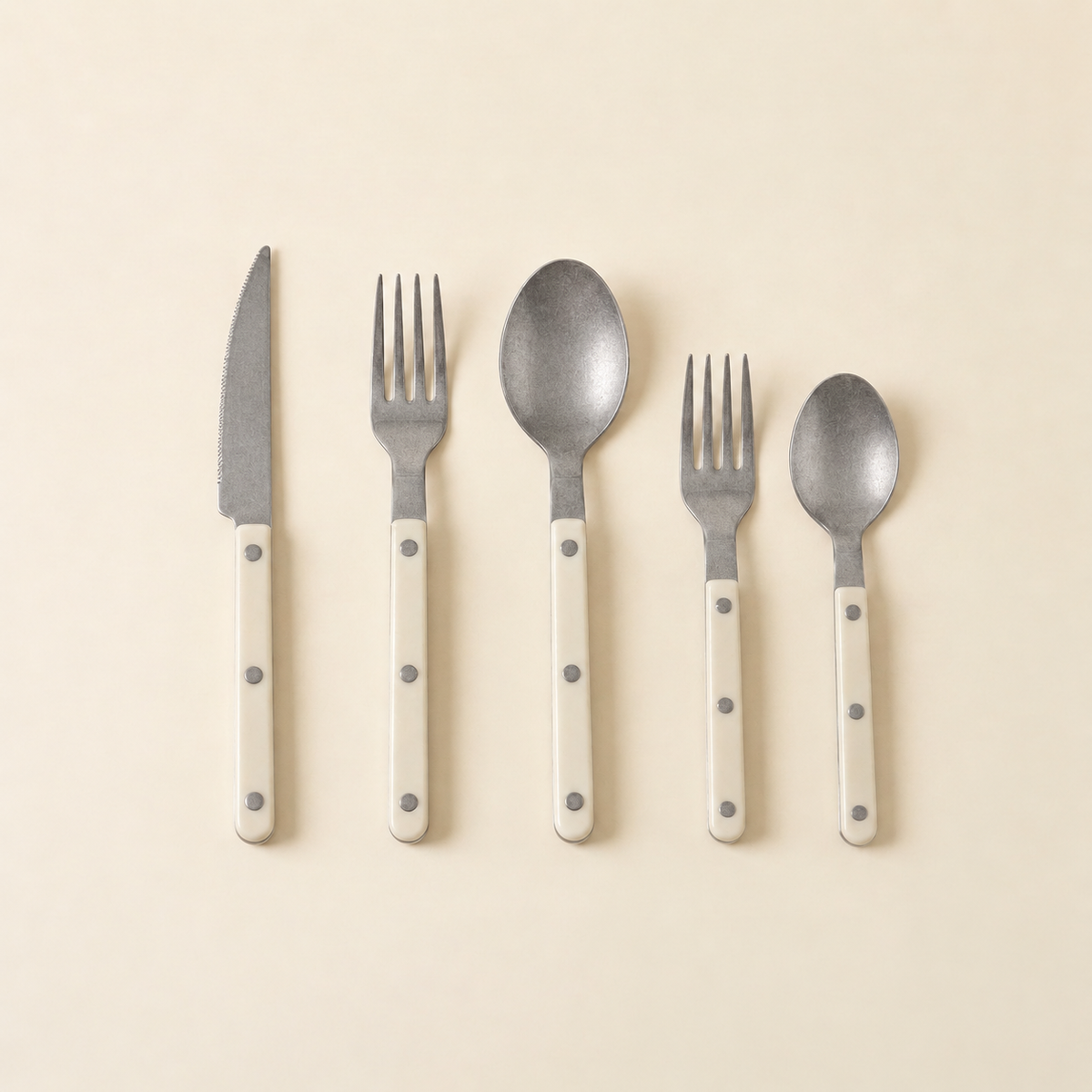 Matte antique-finish riveted 5-piece flatware set in creamy white, without chopsticks